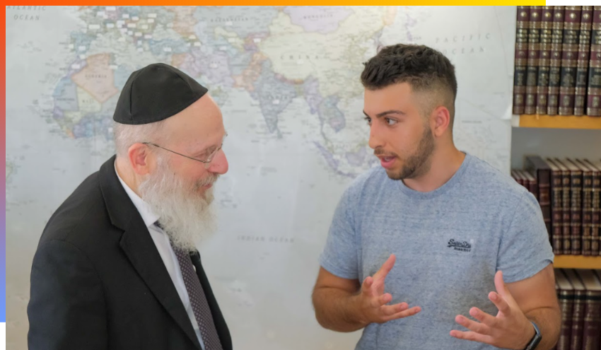 Rabbi Berkovitz and Aish student talking