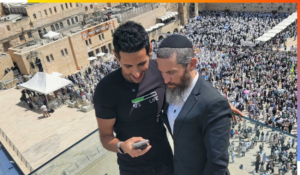Nuseir Yassin with Rabbi Dov Ber Cohen on the roof of the Dan Family Aish World Center