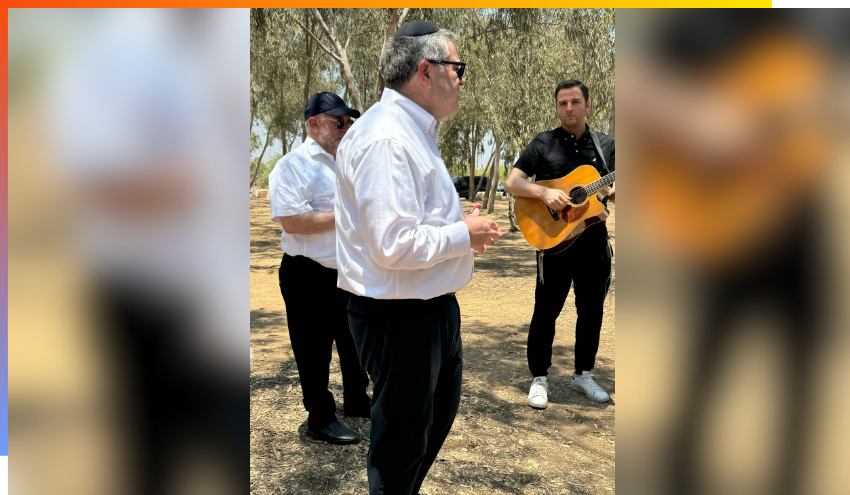 Rabbi Steven Burg speaking at the site of the Octobere 7th massacre