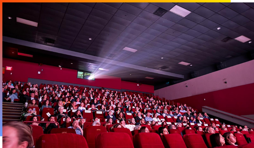 Audience members watching the screening of the film October 7th - Voices of Pain, Hope and Heroism in Manhattan.