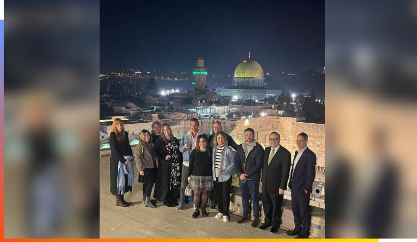 Journalists pose for a picture on the Aish rooftop