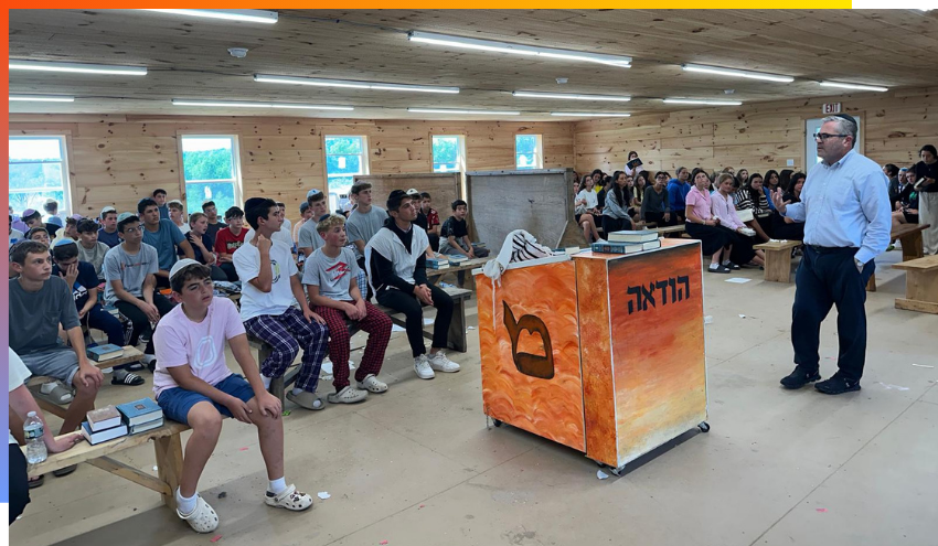 Rabbi Burg speaking at camp Mesorah
