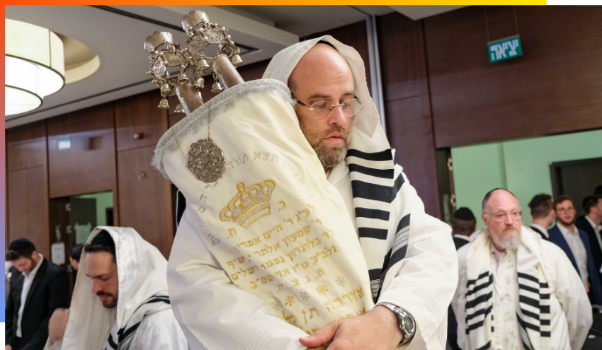Holding a Torah during davening