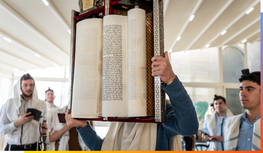 Man holding a Torah