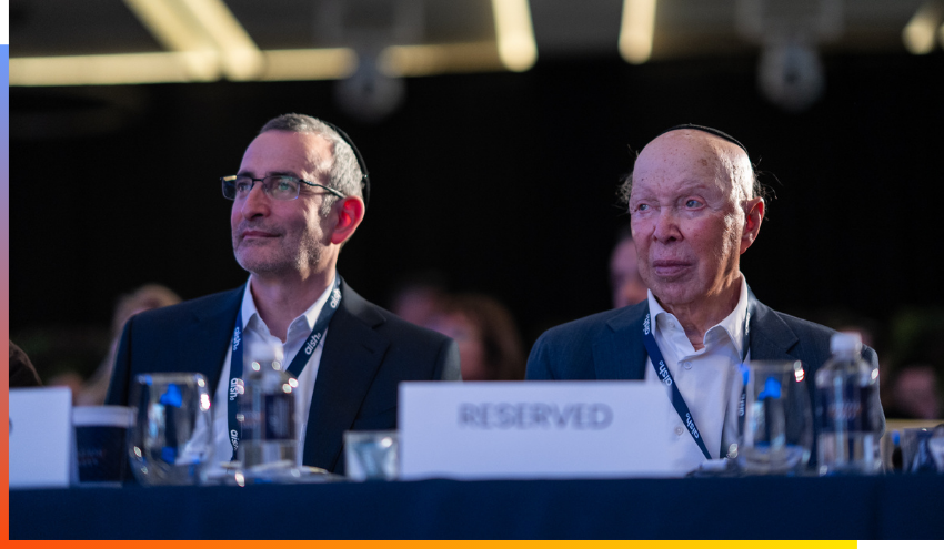 Leslie Dan (right) sits with Chairman of Aish, Dr. Stuart Hytman, at the February Aish Legacy Summit in Bal Harbour, Florida.