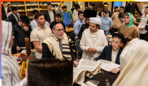 Rabbi Rosman reading the Megillah at the Aish Yeshiva.