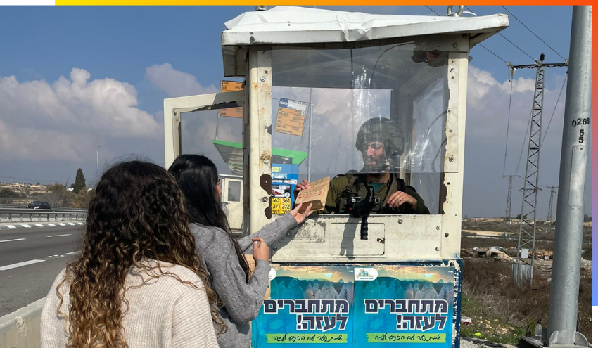 girls giving supplies to IDF soldiers