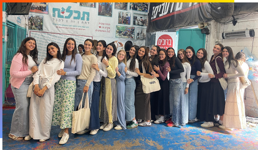efg@aish students pose for a group photo after packaging food for needy families in Jerusalem earlier this year.