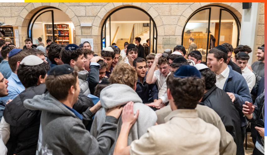 efg@aish students celebrate in the Beit Midrash after completing a group study challenge.