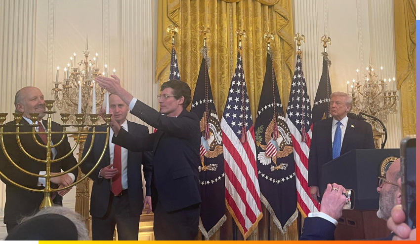 U.S. President Donald Trump looks on as a menorah is lit at the White House during Chanukkah.