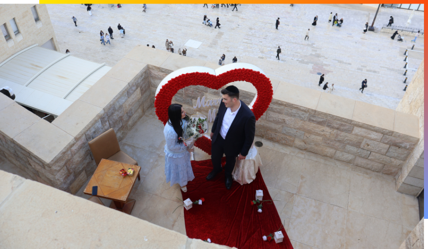 A couple gets engaged on the Diener Terrace overlooking the Kotel plaza at the Dan Family Aish World Center this week.
