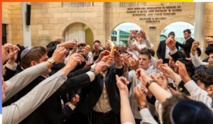 Aish students participating in Havdalah after a Shabbos in Yeshiva.