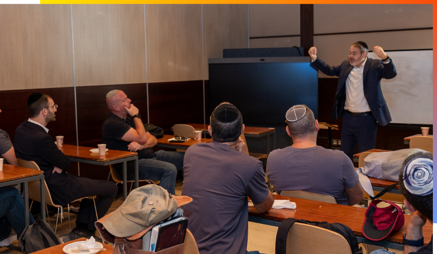 Rabbi Daniel Rowe teaches a class at the Dan Family Aish World Center on the topic of Shavuos and God’s relationship with man.