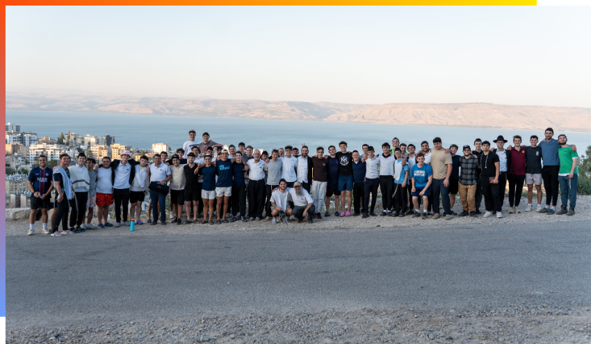 Aish students and staff stand arm-in-arm during a trip to the Galilee.