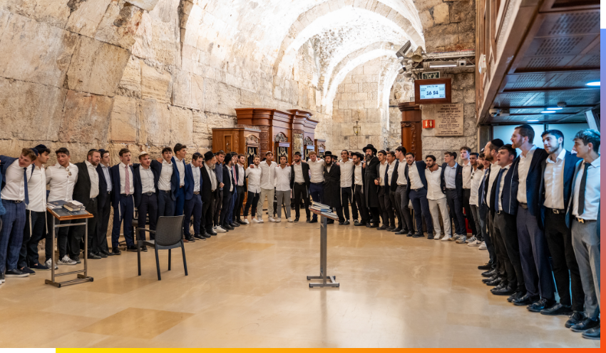 Aish students gather to pray at the Kotel after their final banquet of the year.