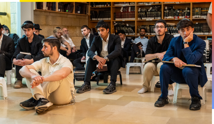 Aish students and staff listening to Eicha in the Beit Midrash