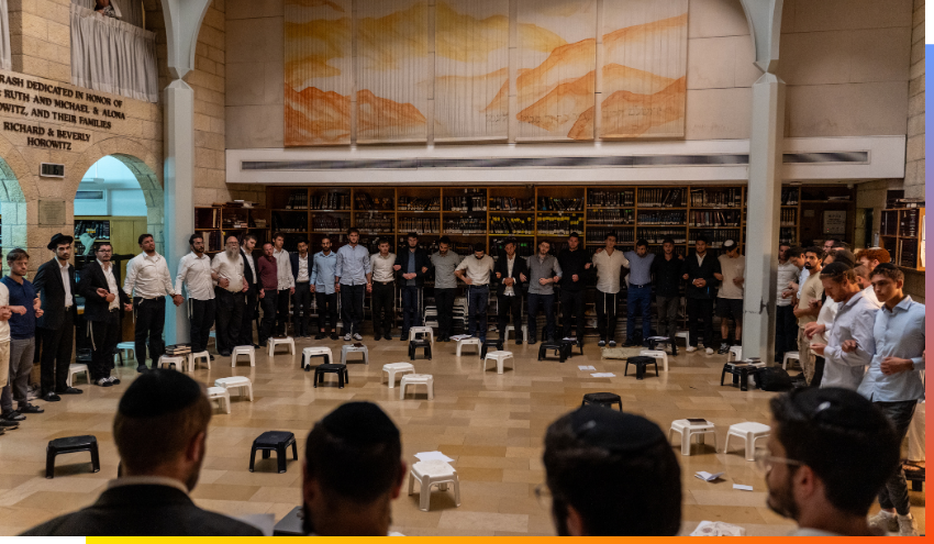 Aish students staff and guests standing and singing together