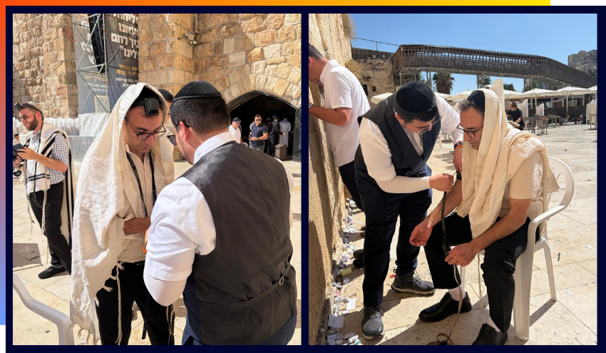 Ben putting on a Tallis and Tefillin at the Kotel