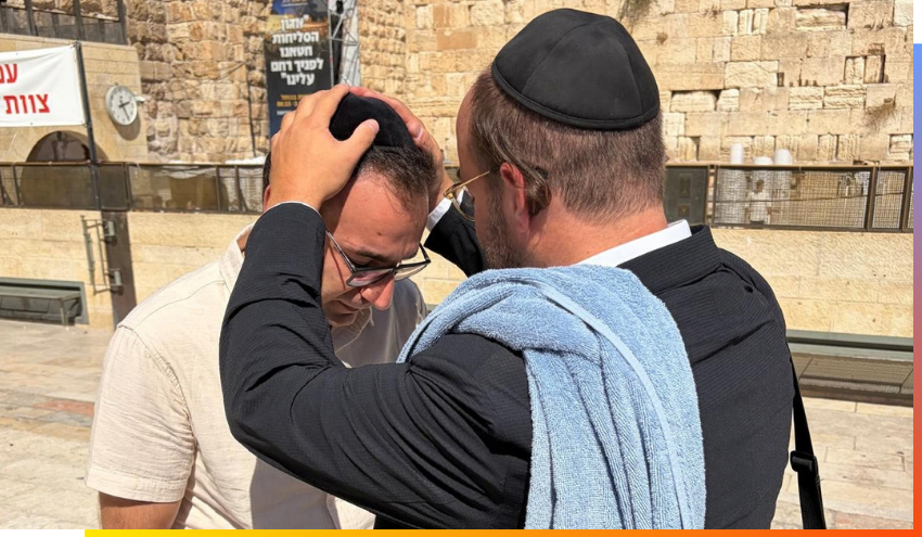 Ben receiving a bracha from one of the Aish staff, at the Kotel before Yom Kippur