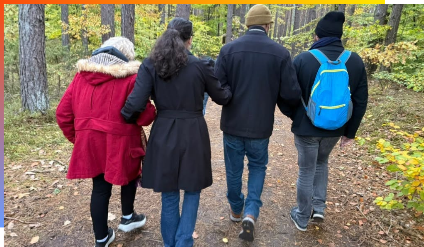 Holocaust survivor and Nova massacre survivor walking together during the trip in Poland