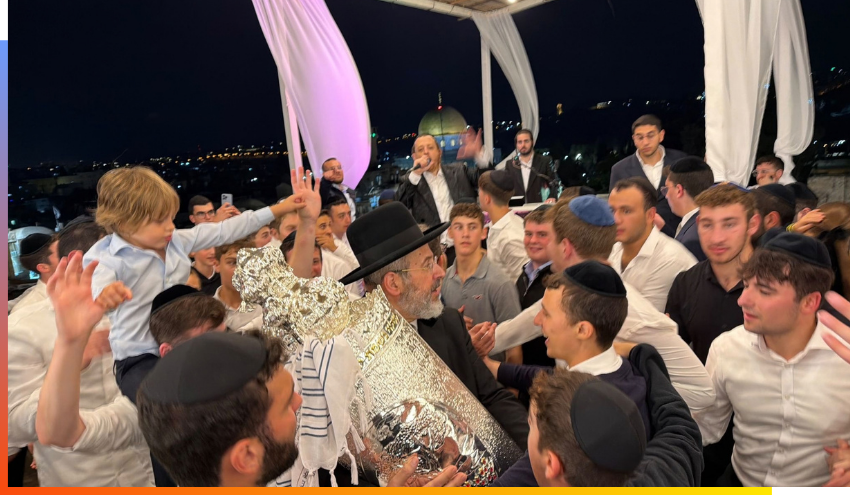 Rabbi Lau dancing with the newly dedicated Torah